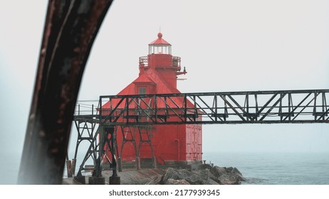 Sturgeon Bay Red Light House With Scaffolding Walkway On A Rock Island