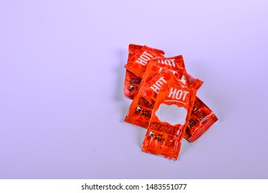 Sturtevant, Wisconsin / USA - August 20, 2019:  A Small Handful Of Taco Bell Hot Sauce Packets With A Blank Note Area On The Front Packet.  Isolated On A White Background. 