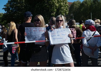 STUTTGART, BADEN WÜRTTEMBERG/GERMANY April 25 2020: Anti-lockdown Protestors At The Main Squere In Stuttgart (Schloßplatz). They Claim To Fight For The Constitunial Rights (grundgesetz).