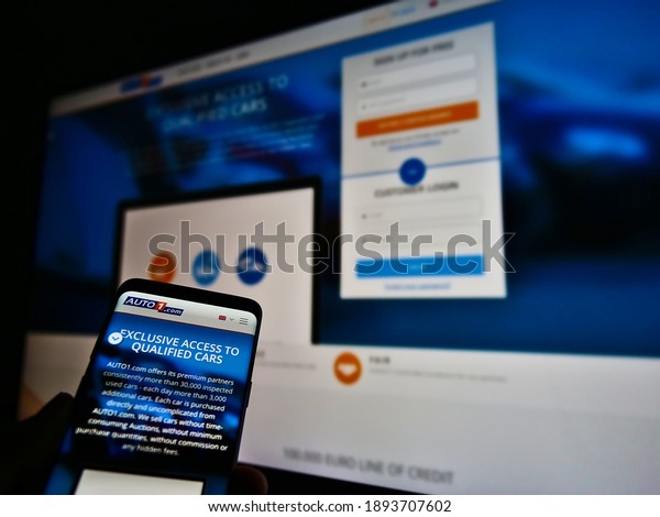 Stuttgart,\
Germany - 01-13-2021: Website of second-hand vehicle dealer Auto1\
Group, a German startup business, displayed on smartphone. Focus on\
company logo on top of mobile phone\
screen.