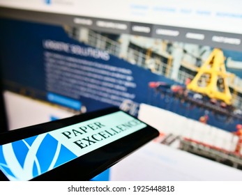 Stuttgart, Germany - 02-07-2021: Mobile phone with logo of Canadian paper and pulp manufacturer Paper Excellence on screen in front of website. Focus on center-left of phone display. Unmodified photo. - Shutterstock ID 1925448818