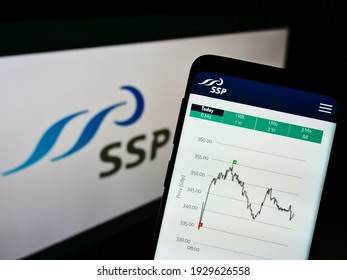 Stuttgart, Germany - 02-27-2021: Smartphone With Web Page And Stock Chart Of British Foodservice Company SSP Group Plc On Screen In Front Of Logo. Focus On Center Of Phone Display. Unmodified Photo.