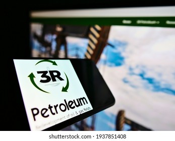 Stuttgart, Germany - 02-28-2021: Mobile phone with logo of Brazilian oil and gas company 3R Petroleum S.A. on screen in front of web page. Focus on center-riight of phone display. Unmodified photo.