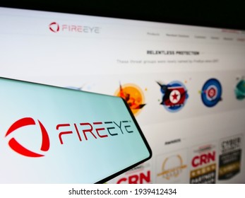 Stuttgart, Germany - 03-07-2021: Mobile Phone With Business Logo Of American Cybersecurity Company FireEye Inc. On Screen In Front Of Web Page. Focus On Center Of Phone Display. Unmodified Photo.