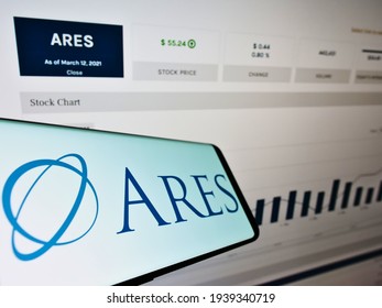Stuttgart, Germany - 03-13-2021: Cellphone with logo of American investment company Ares Management Corporation on screen in front of website. Focus on center-right of phone display. Unmodified photo.