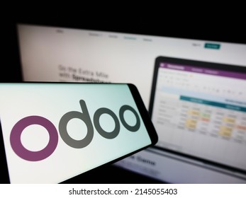 Stuttgart, Germany - 03-29-2022: Cellphone with logo of French software company Odoo SA on screen in front of business website. Focus on left of phone display. Unmodified photo.