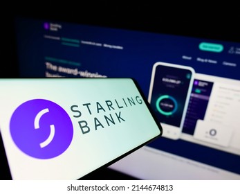 Stuttgart, Germany - 03-30-2022: Smartphone With Logo Of British Challenger Bank Starling Bank Limited On Screen In Front Of Website. Focus On Center-left Of Phone Display. Unmodified Photo.