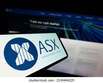 Stuttgart, Germany - 05-15-2022: Mobile phone with logo of Australian Securities Exchange Ltd (ASX) on screen in front of business website. Focus on left of phone display. Unmodified photo.