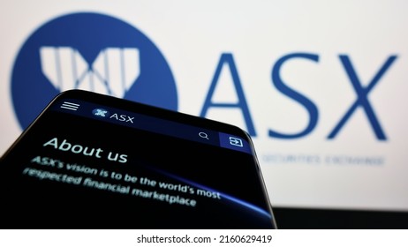 Stuttgart, Germany - 05-15-2022: Smartphone with website of Australian Securities Exchange Ltd (ASX) on screen in front of company logo. Focus on top-left of phone display. Unmodified photo.