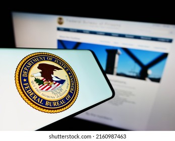 Stuttgart, Germany - 05-20-2022: Smartphone With Seal Of US Agency Federal Bureau Of Prisons (BOP) On Screen In Front Of Website. Focus On Center Of Phone Display. Unmodified Photo.