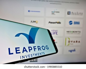 Stuttgart, Germany - 05-21-2021: Mobile phone with logo of private equity business LeapFrog Investments on screen in front of company website. Focus on center-left of phone display. Unmodified photo.