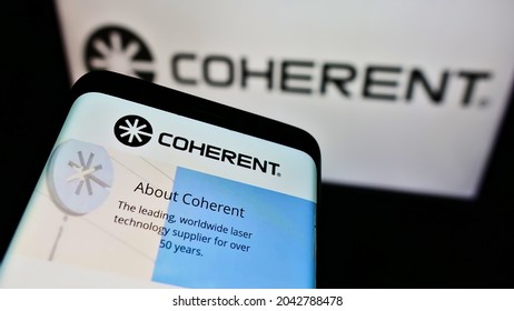 Stuttgart, Germany - 05-21-2021: Mobile phone with company webpage of US laser manufacturer Coherent Inc. on screen in front of business logo. Focus on top-left of phone display. Unmodified photo.
