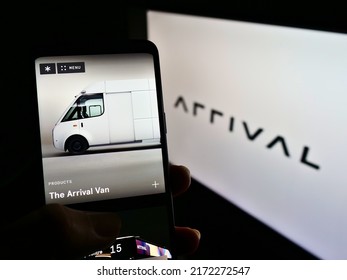 Stuttgart, Germany - 05-21-2021: Person Holding Cellphone With Webpage Of Electric Vehicle Manufacturer Arrival Ltd On Screen In Front Of Logo. Focus On Center Of Phone Display. Unmodified Photo.