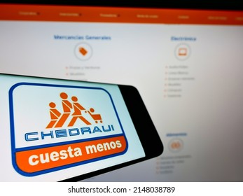 Stuttgart, Germany - 05-22-2021: Smartphone With Business Logo Of Mexican Grupo Comercial Chedraui S.A.B. De C.V. On Screen In Front Of Website. Focus On Center Of Phone Display. Unmodified Photo.