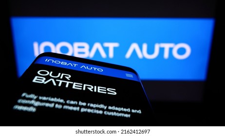 Stuttgart, Germany - 05-22-2022: Smartphone With Webpage Of Slovak Battery Company InoBat Auto On Screen In Front Of Business Logo. Focus On Top-left Of Phone Display. Unmodified Photo.