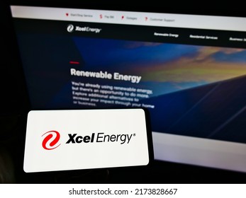 Stuttgart, Germany - 05-23-2021: Person Holding Cellphone With Logo Of US Utility Company Xcel Energy Inc. On Screen In Front Of Business Website. Focus On Phone Display. Unmodified Photo.