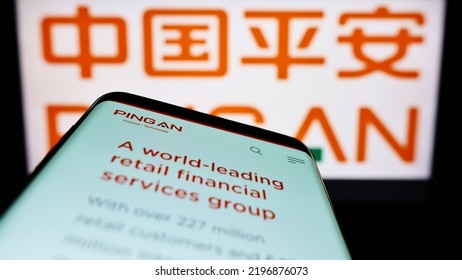 Stuttgart, Germany - 06-06-2022: Mobile Phone With Website Of Ping An Insurance (Group) Company Of China Ltd. On Screen In Front Of Logo. Focus On Top-left Of Phone Display. Unmodified Photo.