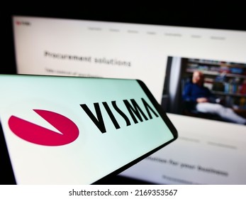 Stuttgart, Germany - 06-12-2022: Mobile phone with logo of Norwegian software company Visma AS on screen in front of business website. Focus on center of phone display. Unmodified photo.