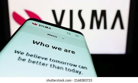 Stuttgart, Germany - 06-12-2022: Smartphone with webpage of Norwegian software company Visma AS on screen in front of business logo. Focus on top-left of phone display. Unmodified photo.