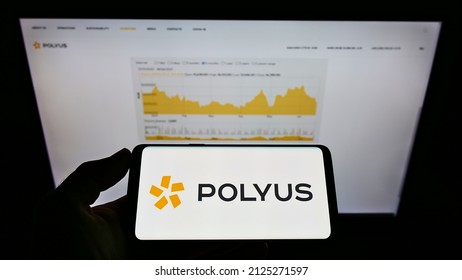 Stuttgart, Germany - 06-19-2021: Person Holding Smartphone With Logo Of Russian Gold Mining Company PJSC Polyus On Screen In Front Of Website. Focus On Phone Display. Unmodified Photo.