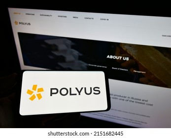 Stuttgart, Germany - 06-19-2021: Person Holding Cellphone With Logo Of Russian Gold Mining Company PJSC Polyus On Screen In Front Of Business Webpage. Focus On Phone Display. Unmodified Photo.