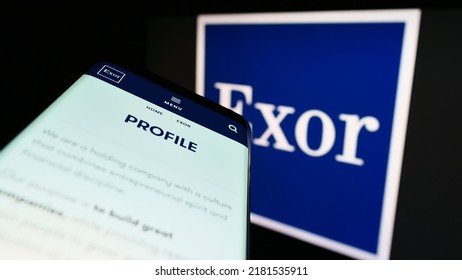 Stuttgart, Germany - 07-15-2022: Mobile Phone With Website Of Dutch Investment Company Exor N.V. On Screen In Front Of Business Logo. Focus On Top-left Of Phone Display. Unmodified Photo.