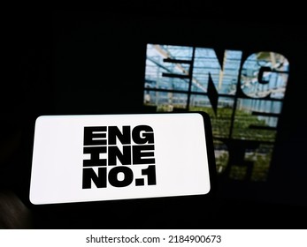 Stuttgart, Germany - 07-24-2022: Person holding cellphone with logo of US investment company Engine No. 1 LP on screen in front of business webpage. Focus on phone display. Unmodified photo.