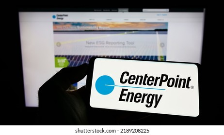 Stuttgart, Germany - 07-24-2022: Person Holding Cellphone With Logo Of US Utility Company CenterPoint Energy Inc. On Screen In Front Of Business Webpage. Focus On Phone Display. Unmodified Photo.