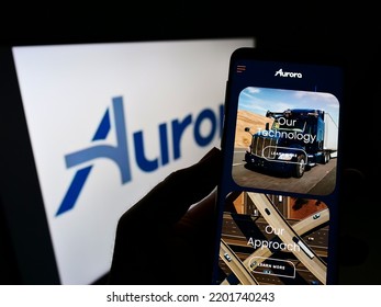 Stuttgart, Germany - 07-31-2021: Person Holding Cellphone With Webpage Of Self-driving Vehicle Company Aurora Innovation Inc. On Screen With Logo. Focus On Center Of Phone Display. Unmodified Photo.