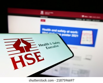 Stuttgart, Germany - 07-31-2022: Mobile Phone With Logo Of UK Agency Health And Safety Executive (HSE) On Screen In Front Of Website. Focus On Left Of Phone Display. Unmodified Photo.