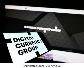 Stuttgart, Germany - 07-31-2022: Smartphone With Logo Of American Company Digital Currency Group Inc. (DCG) On Screen In Front Of Website. Focus On Center-left Of Phone Display. Unmodified Photo.