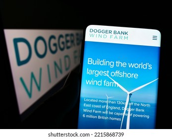 Stuttgart, Germany - 09-11-2022: Person Holding Cellphone With Website Of Offshore Energy Generator Dogger Bank Wind Farm On Screen With Logo. Focus On Center Of Phone Display. Unmodified Photo.