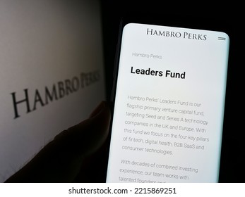 Stuttgart, Germany - 09-13-2022: Person Holding Cellphone With Webpage Of British Investment Company Hambro Perks Limited On Screen With Logo. Focus On Center Of Phone Display. Unmodified Photo.