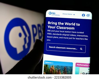 Stuttgart, Germany - 10-01-2022: Person Holding Cellphone With Webpage Of US Tv Network Public Broadcasting Service (PBS) On Screen With Logo. Focus On Center Of Phone Display. Unmodified Photo.