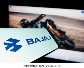 Stuttgart, Germany - 10-15-2022: Mobile Phone With Logo Of Indian Automotive Company Bajaj Auto Limited On Screen In Front Of Website. Focus On Center-left Of Phone Display. Unmodified Photo.