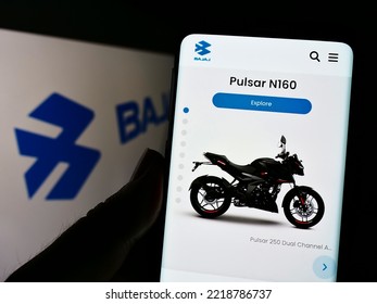 Stuttgart, Germany - 10-15-2022: Person Holding Cellphone With Webpage Of Indian Automotive Company Bajaj Auto Limited On Screen With Logo. Focus On Center Of Phone Display. Unmodified Photo.