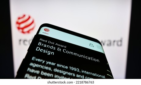 Stuttgart, Germany - 10-15-2022: Smartphone With Webpage Of German International Prize Red Dot Design Award On Screen In Front Of Logo. Focus On Top-left Of Phone Display. Unmodified Photo.