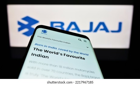 Stuttgart, Germany - 10-15-2022: Smartphone With Website Of Indian Automotive Company Bajaj Auto Limited On Screen In Front Of Business Logo. Focus On Top-left Of Phone Display. Unmodified Photo.