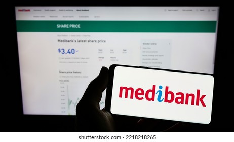 Stuttgart, Germany - 10-17-2022: Person Holding Mobile Phone With Logo Of Health Insurance Company Medibank Private Limited On Screen In Front Of Web Page. Focus On Phone Display. Unmodified Photo.