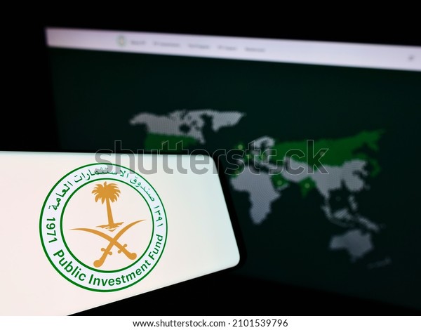 Stuttgart, Germany - 12-18-2021: Cellphone with\
logo of Saudi Arabian Public Investment Fund (PIF) on screen in\
front of business website. Focus on center-left of phone display.\
Unmodified photo.