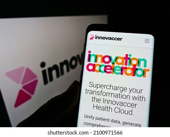 Stuttgart, Germany - 12-19-2021: Person Holding Cellphone With Website Of US Healthcare Data Company Innovaccer Inc. On Screen In Front Of Logo. Focus On Center Of Phone Display. Unmodified Photo.