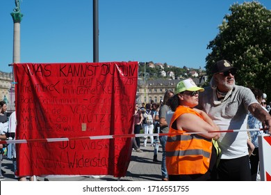 STUTTGART, GERMANY - APRIL 26, 2020: Anti Lockdown Protest In Stuttgart, Held At Schloßplatz. Protestors Claim That The Anti COVID-19 Measures Are Against The Spirit Of The Constitution. 