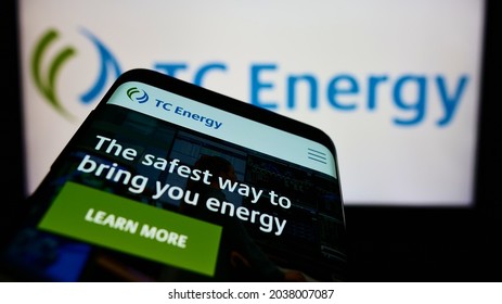 STUTTGART, GERMANY - Aug 16, 2021: Smartphone With Website Of Canadian Company TC Energy Corporation On Screen In Front Of Logo  Focus On Top-left Of Phone Display 