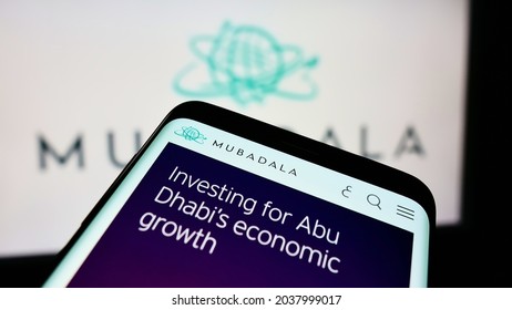 STUTTGART, GERMANY - Aug 23, 2021: Cellphone With Webpage Of Investor Mubadala Investment Company PJSC On Screen In Front Of Logo  Focus On Top-left Of Phone Display 