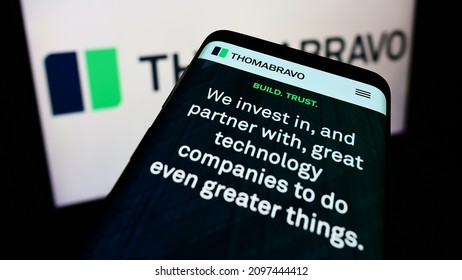 STUTTGART, GERMANY - Dec 13, 2021: Mobile Phone With Website Of American Private Equity Company Thoma Bravo L P  On Screen In Front Of Logo  Focus On Top-left Of Phone Display 