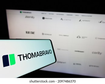 STUTTGART, GERMANY - Dec 13, 2021: Smartphone With Logo Of US Private Equity Company Thoma Bravo L P  On Screen In Front Of Business Website  Focus On Center-left Of Phone Display 