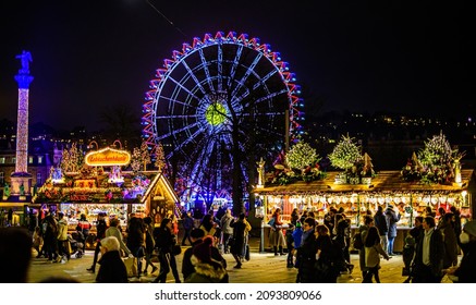 Stuttgart, Germany - December 17: Visitors at the annual exhibition of illuminated symbols at the Christmas market in the old town of Stuttgart on December 17, 2021 - Shutterstock ID 2093809066