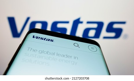 STUTTGART, GERMANY - Jan 24, 2022: Mobile phone with webpage of Danish company Vestas Wind Systems AS on screen in front of business logo  Focus on top-left of phone display 