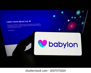 STUTTGART, GERMANY - Jun 22, 2021: Person Holding Cellphone With Logo Of British Healthcare Company Babylon Health On Screen In Front Of Business Webpage  Focus On Phone Display 