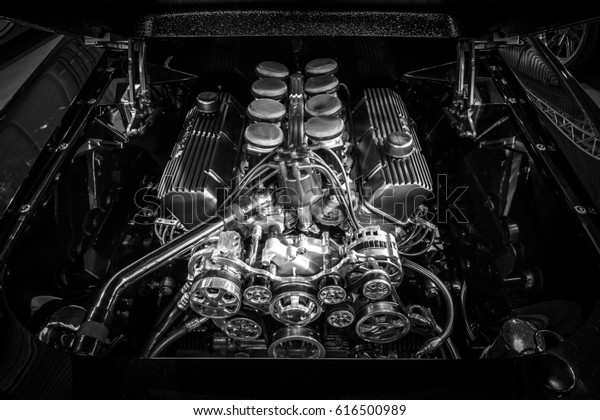 STUTTGART, GERMANY - MARCH 03, 2017: The fuel\
injected 460 big block the Ford engine (550 HP, 7,5L) of Ford\
Mustang, 1967. Black and white.  Europe\'s greatest classic car\
exhibition \